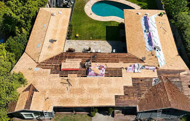 spotlight-roofing-construction-team-working-on-a-roof